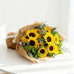 Sunflower bouquet wrapped in rustic paper, perfect for same-day flower delivery across Singapore