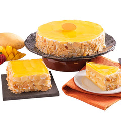 Fresh mango almond cake slices with fruit, ideal for cake and flower delivery in Singapore
