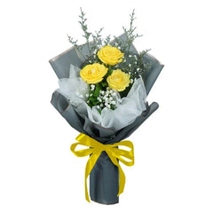 Yellow rose bouquet wrapped in gray paper with yellow ribbon, perfect for flower delivery in Singapore