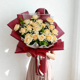 Large bouquet of peach roses with greenery and baby's breath, ideal for flower delivery