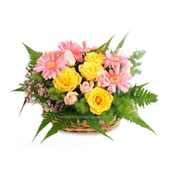Pastel yellow roses and pink flowers in a basket, ideal for Singapore flower delivery