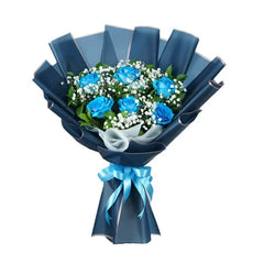 Blue rose bouquet with baby's breath, wrapped for flower delivery in Singapore