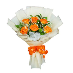 Flower delivery of orange rose bouquet with greenery and baby's breath, wrapped in white paper