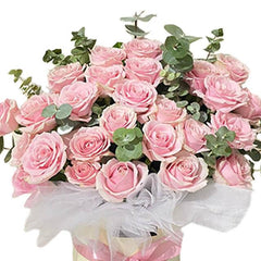 Pink roses bloom box arrangement with greenery, perfect for flower delivery in Singapore