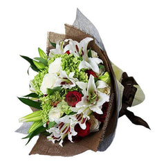 Mixed roses and lilies bouquet with white, red, green flowers for flower delivery