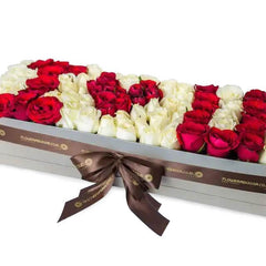 Box of mixed red and white roses arranged with I Love You text for flower delivery