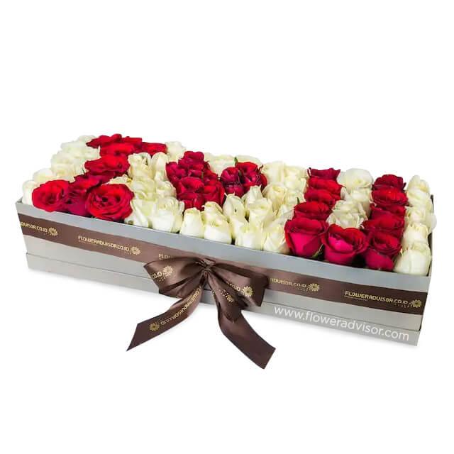 Luxury box of mixed red and white roses spelling I Love You, perfect for flower delivery