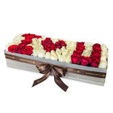 Luxury box of mixed red and white roses spelling I Love You, perfect for flower delivery