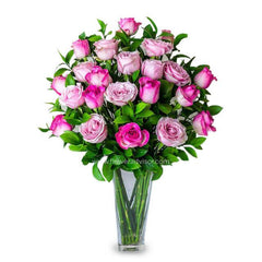 Lilac and two-tone pink rose bouquet in glass vase for flower delivery