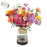 Vibrant mixed flower bouquet in a clear vase for flower delivery in Singapore