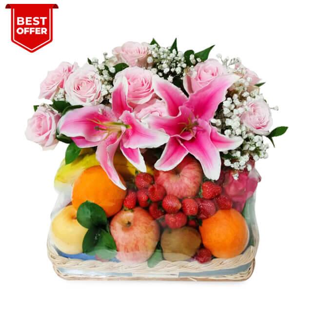 Fresh flower and fruit hamper with pink lilies, roses, and assorted tropical fruits for delivery