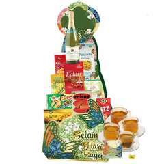 Hari Raya gift hamper with assorted snacks, sparkling juice, and tea, ideal for flower delivery.
