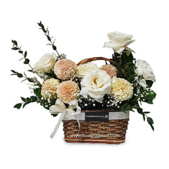 Fresh flower delivery basket with white roses and peach carnations arrangement