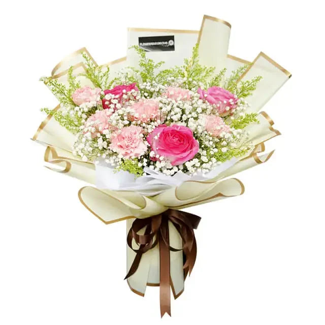 Hand bouquet with pink roses and carnations, ideal for flower delivery in Singapore