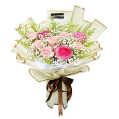 Hand bouquet with pink roses and carnations, ideal for flower delivery in Singapore