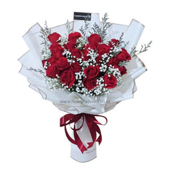 Hand bouquet of 23 red roses with white baby’s breath, perfect for romantic flower delivery.