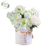 Elegant white flower bouquet in a gift box for fresh flower delivery in Singapore