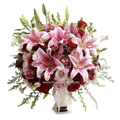 Pink lilies and red roses table arrangement for flower delivery in Singapore