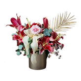 Elegant Deepavali floral arrangement with red lilies, pink rose, gold palm in vase for flower delivery