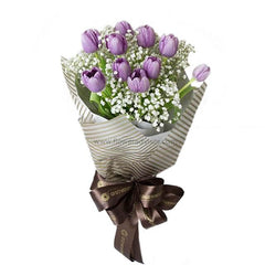 Elegant bouquet of purple tulips with baby's breath, ideal for flower delivery in Singapore