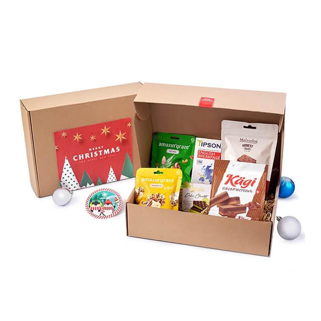 Festive holiday hamper with snacks and Christmas card, ideal for flower gift delivery