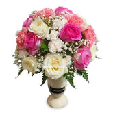 Elegant pink and white flower arrangement in a vase for flower delivery in Singapore