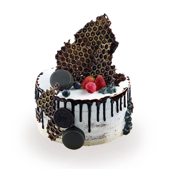 Artisanal cream cake with chocolate decor and berries, elegant cake for flower delivery gifts