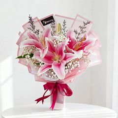 Pink lily bouquet with baby's breath, ideal for fresh flower delivery in Singapore