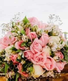 Pink and white rose bouquet for flower delivery, fresh blooms with green leaves