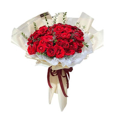 Elegant bouquet of 44 red roses with greenery, perfect for flower delivery in Singapore