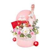 Pink flower delivery gift hamper with fresh flowers, wine, and festive holiday card