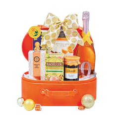Gift hamper with sparkling rose wine, tea, chocolates, and festive treats for flower delivery