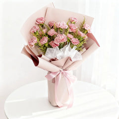 Pink carnation bouquet with pastel wrapping, ideal for flower delivery in Singapore