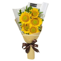 Sunflower bouquet with greenery and white accents, perfect for flower delivery in Singapore