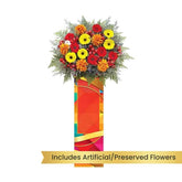 Standing flower arrangement with red, yellow, and orange blooms for flower delivery