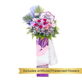 Grand opening flower stand with artificial and preserved flowers, best wishes card, and delivery option.