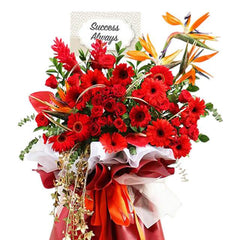 Grand opening flower stand with red gerberas, roses and exotic blooms for delivery in Singapore