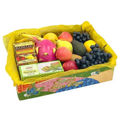Hari Raya fruit and gift hamper with fresh fruits, tea and cake for flower delivery