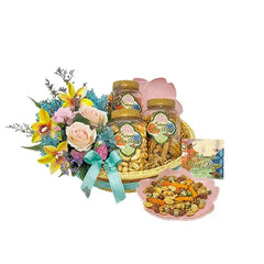 Elegant Hari Raya gift hamper with fresh flower arrangement and festive snacks, perfect for flower delivery.
