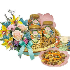 Festive flower delivery basket with assorted cookies, snacks and colorful fresh flowers