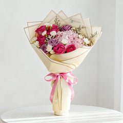 Elegant flower bouquet with pink, purple and white roses for delivery in Singapore