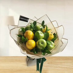 Fruit and flower bouquet with green and yellow apples, perfect for flower delivery