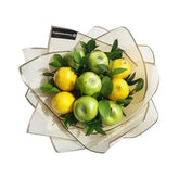 Fruit bouquet with green apples, yellow apples and fresh leaves for flower delivery