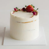 Elegant floral cake with fresh strawberry and flowers, perfect for flower delivery gifts