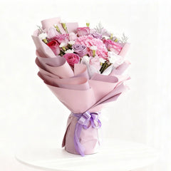 Elegant pink and purple flower bouquet with ribbon for flower delivery in Singapore