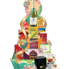 Festive gift hamper with assorted snacks and drinks, perfect for flower delivery gifts