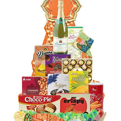 Festive gift hamper with assorted snacks, chocolates, and sparkling juice for flower delivery