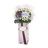 Condolence flower stand with white roses, purple and white blooms, for flower delivery