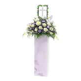 Condolence flower stand with white and purple fresh flowers for delivery
