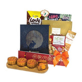 Mid-autumn festival gift hamper with mooncakes, cookies, snacks and festive ribbon, suitable for flower delivery in Singapore.